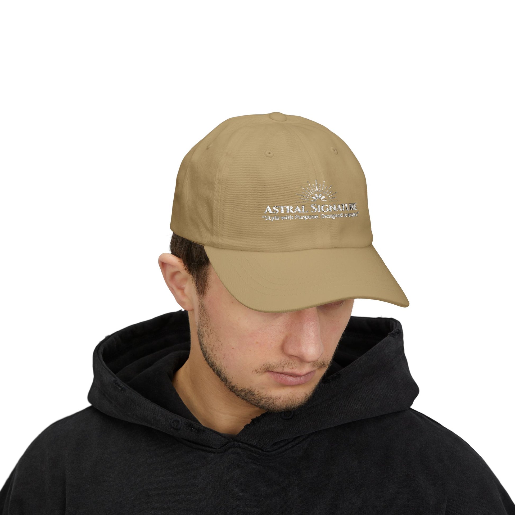 Male model wearing a beige Classic Dad Cap from the Astral Signature Collection. This unisex baseball hat combines comfort with casual headwear style, making it a perfect gift for him. A great choice for Father's Day or for elevating his daily urban fashion.