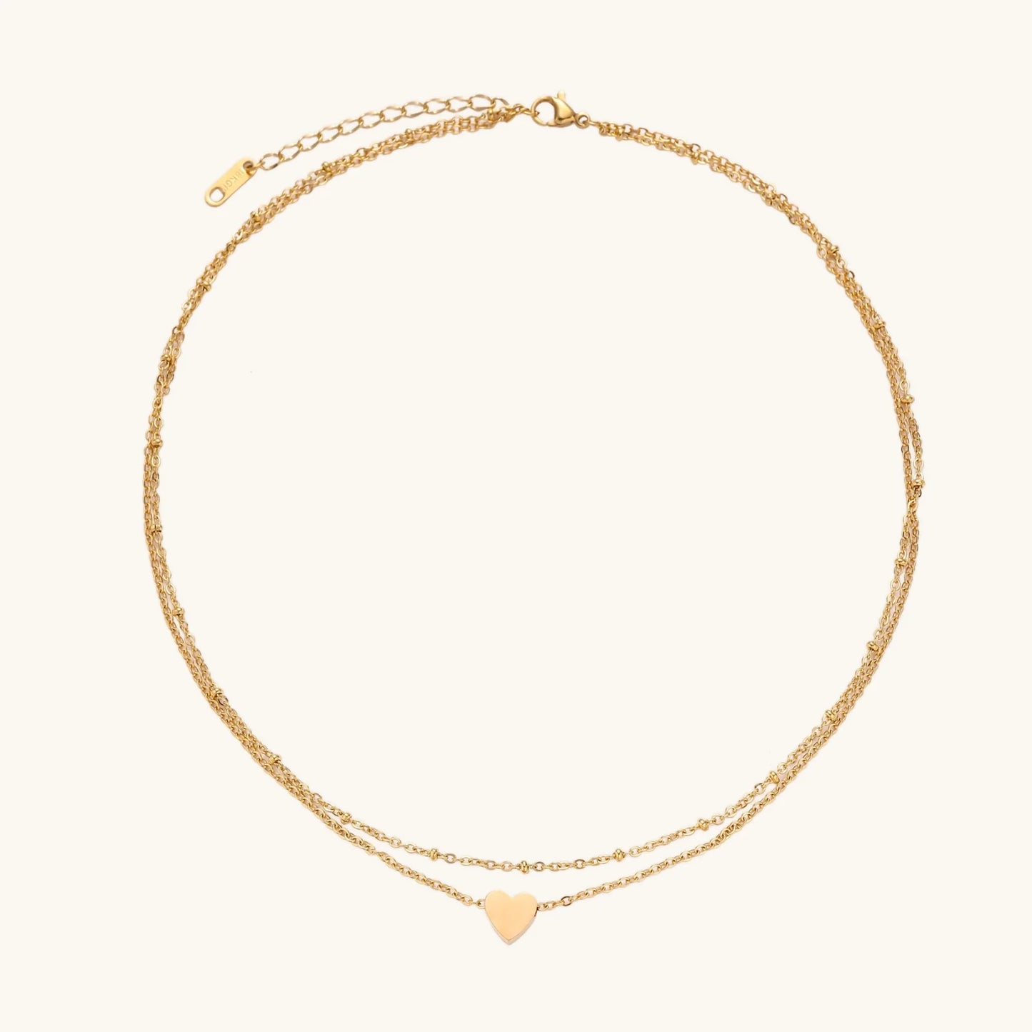 Detailed view of the Layered Heart Necklace - 18K Gold Plated Stainless Steel by Astral Signature, showcasing its intricate design and high-quality craftsmanship. A chic piece for everyday wear and a thoughtful gift for her, available as a limited edition from Astral Design.