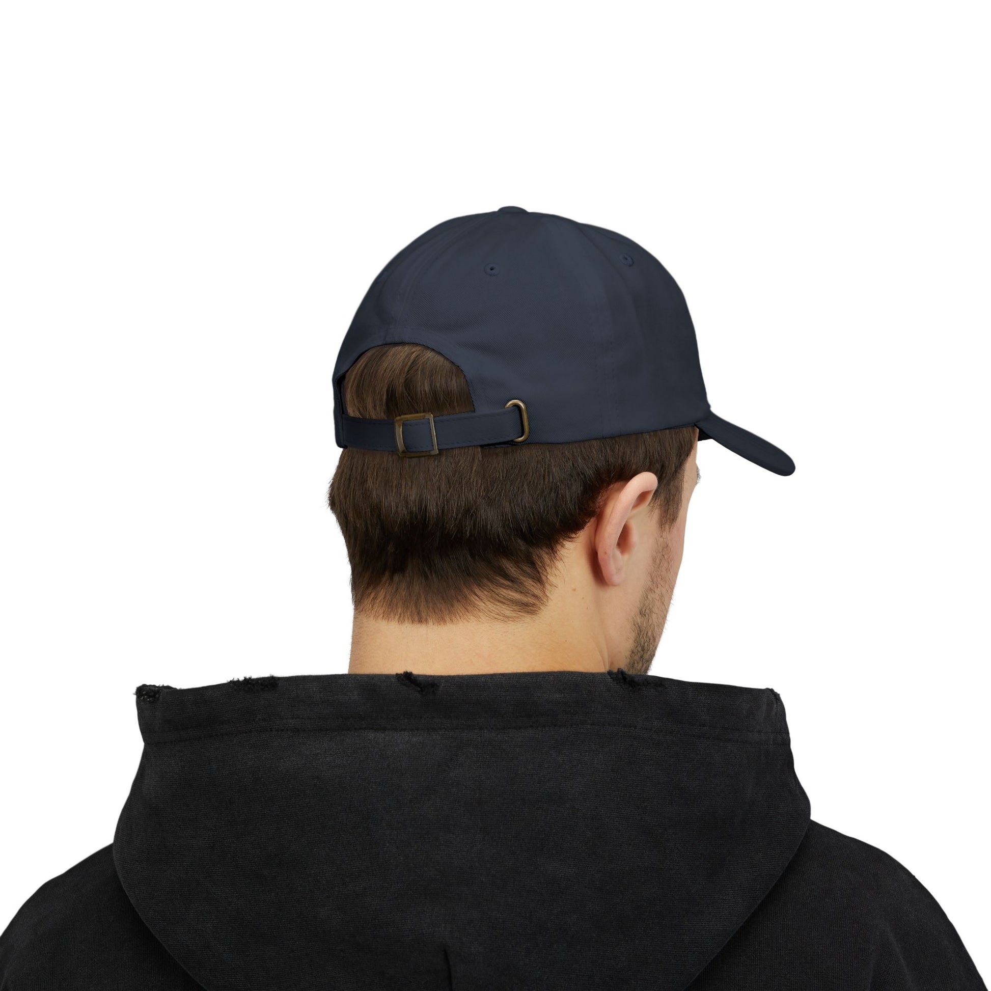 Male model wearing a black Classic Dad Cap from the Astral Signature Collection. This timeless baseball hat is perfect for men looking for stylish casual headwear, making it an excellent Father's Day gift or addition to his everyday cap collection.