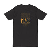 Close-up of Astral Inner Peace Minimalist Tee — Gold ‘PEACE’ Script Men’s T-Shirt featuring the elegant gold graphic on a black background. Ideal as a gift for him, this men’s t-shirt is a staple in men’s fashion.