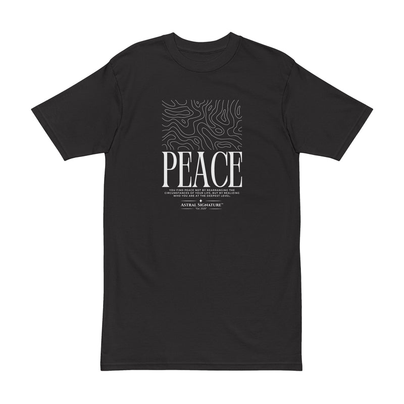 Close-up of the Astral Inner Peace Minimalist Tee showcasing the ‘PEACE’ Script Men’s T-Shirt graphic against a sleek black background, ideal for layering. An excellent gift for him from Astral Signature, this men's tee combines style and comfort.