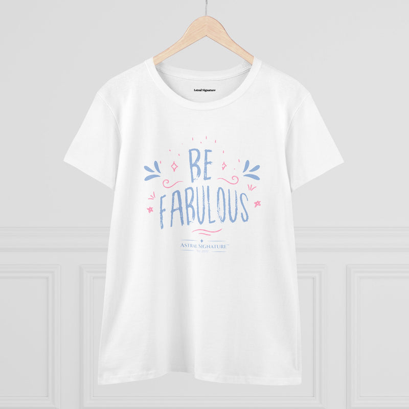 The Be Fabulous Tee by Astral Signature displayed on a wooden hanger, highlighting the inspirational graphic. This Inspirational Graphic Shirt combines comfort and style, perfect for women looking for unique pieces in their Women's T-Shirt lineup. A great choice for those who love feminine attire.
