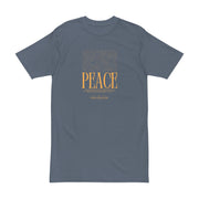 Astral Inner Peace Minimalist Tee — Gold ‘PEACE’ Script Men’s T-Shirt displayed on a neutral background, highlighting its minimalist design. A great gift for him, this men’s heavyweight tee stands out in men’s t-shirts collection.