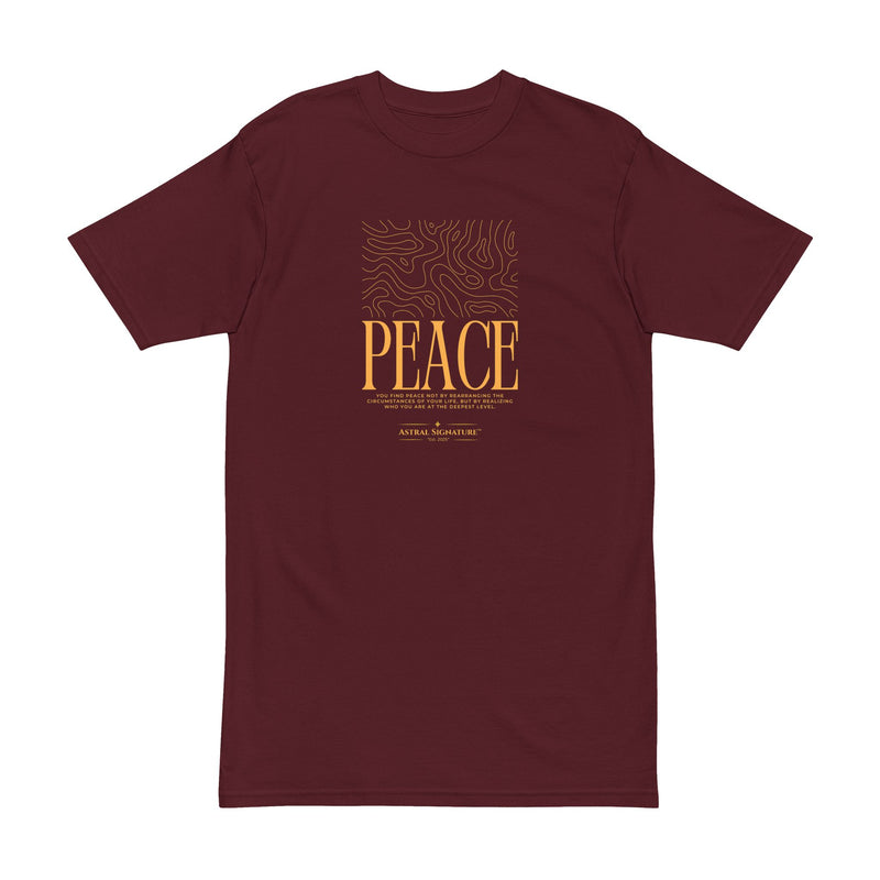 Astral Inner Peace Minimalist Tee — Gold ‘PEACE’ Script Men’s T-Shirt in a rich maroon shade, showcasing its unique graphic. A stylish gift for him, this men’s heavyweight t-shirt combines comfort with modern aesthetics.
