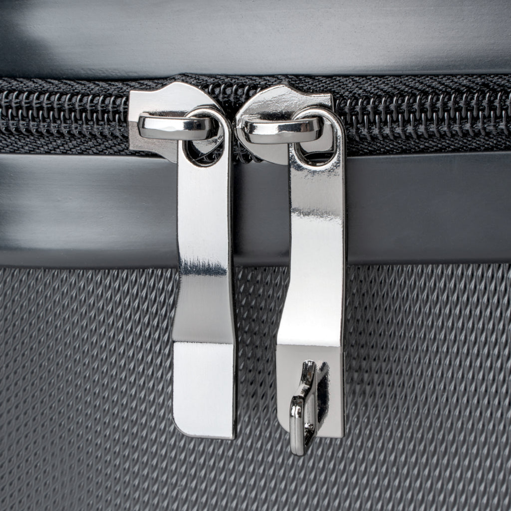 Astral Signature Sacred Travel Suitcase against a scenic backdrop, representing a premium cabin suitcase with cosmic energy.