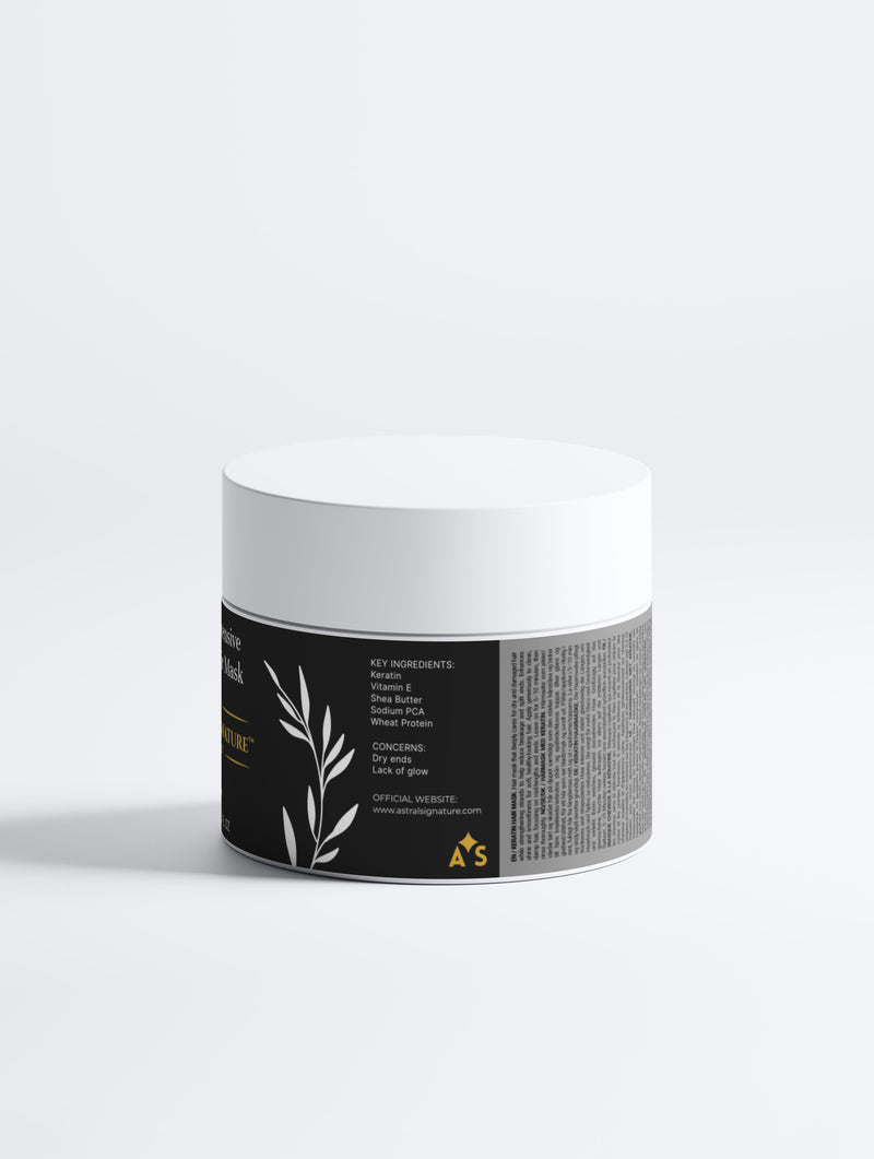 Back view of the Keratin Intensive Rescue Hair Mask by Astral Signature, showcasing key ingredients and benefits. This white packaging is ideal for all skin types and deeply nourishes dry ends while enhancing shine and smoothness. It helps to reduce breakage and split ends through keratin, peptides, and wheat protein, making it a natural certified hair mask solution.