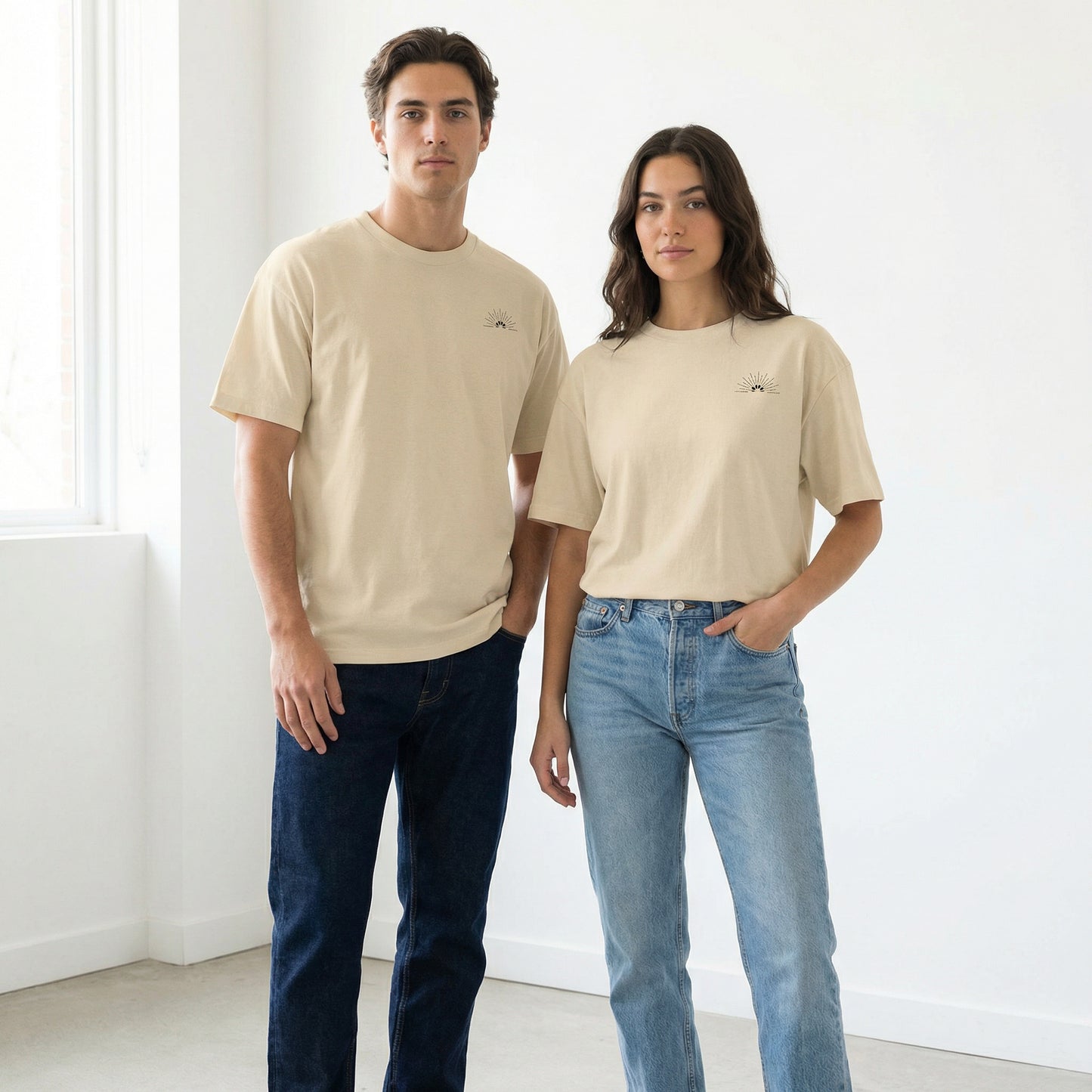 Unisex Classic Logo Tee – Sunrise by Astral Signature displayed on models in a minimal setting. This white casual shirt suits all genders, adding a classic touch to any wardrobe. Perfect for summer, this everyday tee is a staple in basic fashion.