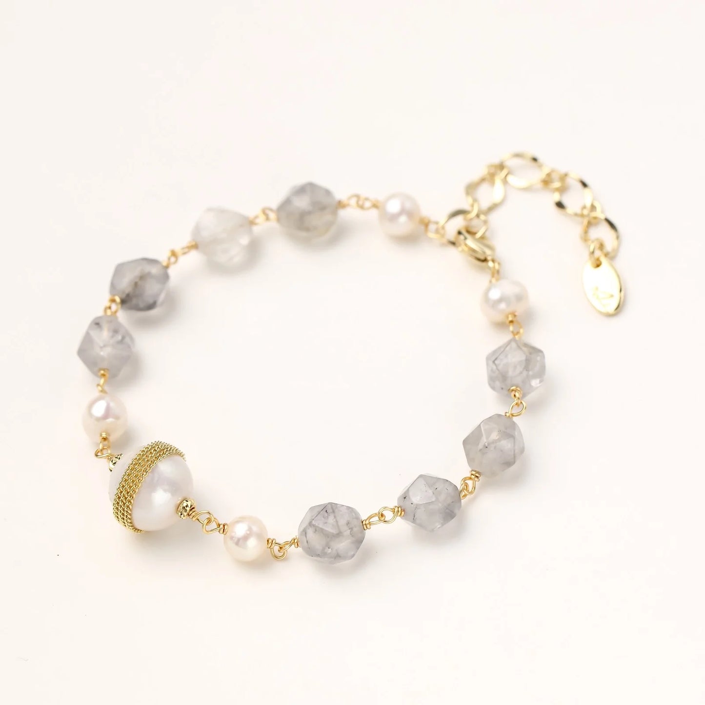 Close-up of the Baroque Pearl Crystal Bracelet by Astral Signature, highlighting the unique combination of cloudy quartz and baroque pearls. Made with 14K Gold Plated Eco-Brass, this bracelet is ideal for everyday wear and a wonderful gift for her, part of the limited edition Astral Design line.