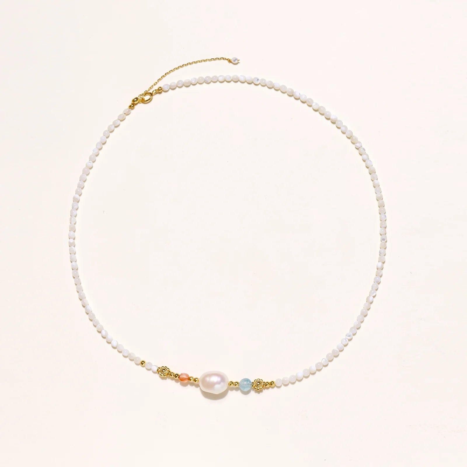 An elegant view of the Pearl Garden Beaded Necklace from Astral Signature, featuring a delicate pearl and colorful stones, set against a soft backdrop. This limited edition necklace is a thoughtful gift for her and embodies the beauty of Astral Design.