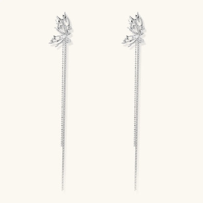 Silver-toned threader earrings featuring detailed fairy figure with wings and dual delicate chain strands, zirconia accents