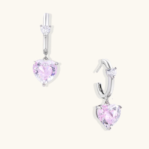 Dainty Pink Heart Drop Hoops by Astral Signature featuring shimmering pink zirconia, perfect Eco-Brass earrings. A stunning gift for her, these White Gold Plated Eco-Brass earrings embody elegant charm.