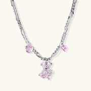Silver twisted chain necklace with fairy tale carriage pendant adorned with pink cubic zirconia gemstones