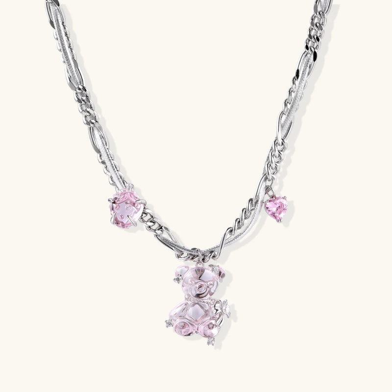 Silver twisted chain necklace with fairy tale carriage pendant adorned with pink cubic zirconia gemstones