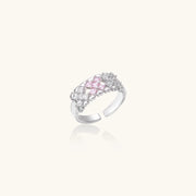 An elegant display of the Pixel Dream Ring — White Gold Plated Eco-Brass • Zirconia by Astral Signature, emphasizing the beauty of pink and white zirconia stones in a versatile adjustable design, perfect as a Gift for Her.
