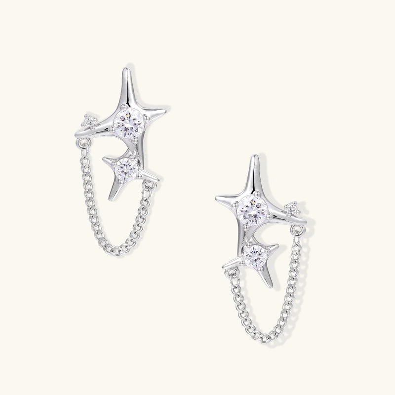 Stardust Chain Studs earrings by Astral Signature, featuring delicate star-shaped designs linked by chains, crafted from Eco-Brass. These sterling silver (S925) earrings are adorned with Zirconia, making them a perfect gift for her.