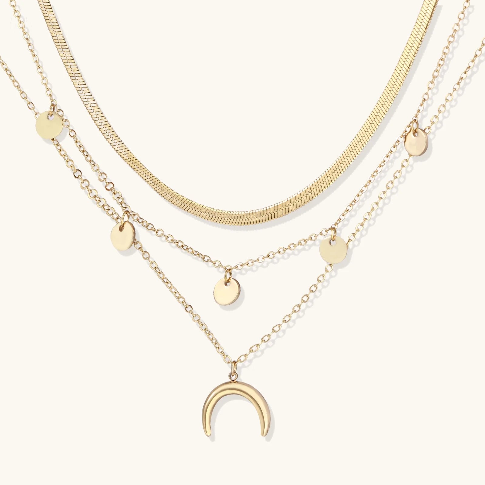 A close-up of the beautiful Golden Crescent Layer Set Necklace by Astral Signature, showcasing its intricate layered design and celestial charm. This limited edition piece is ideal for everyday wear or as a thoughtful gift for her, blending style and elegance effortlessly.