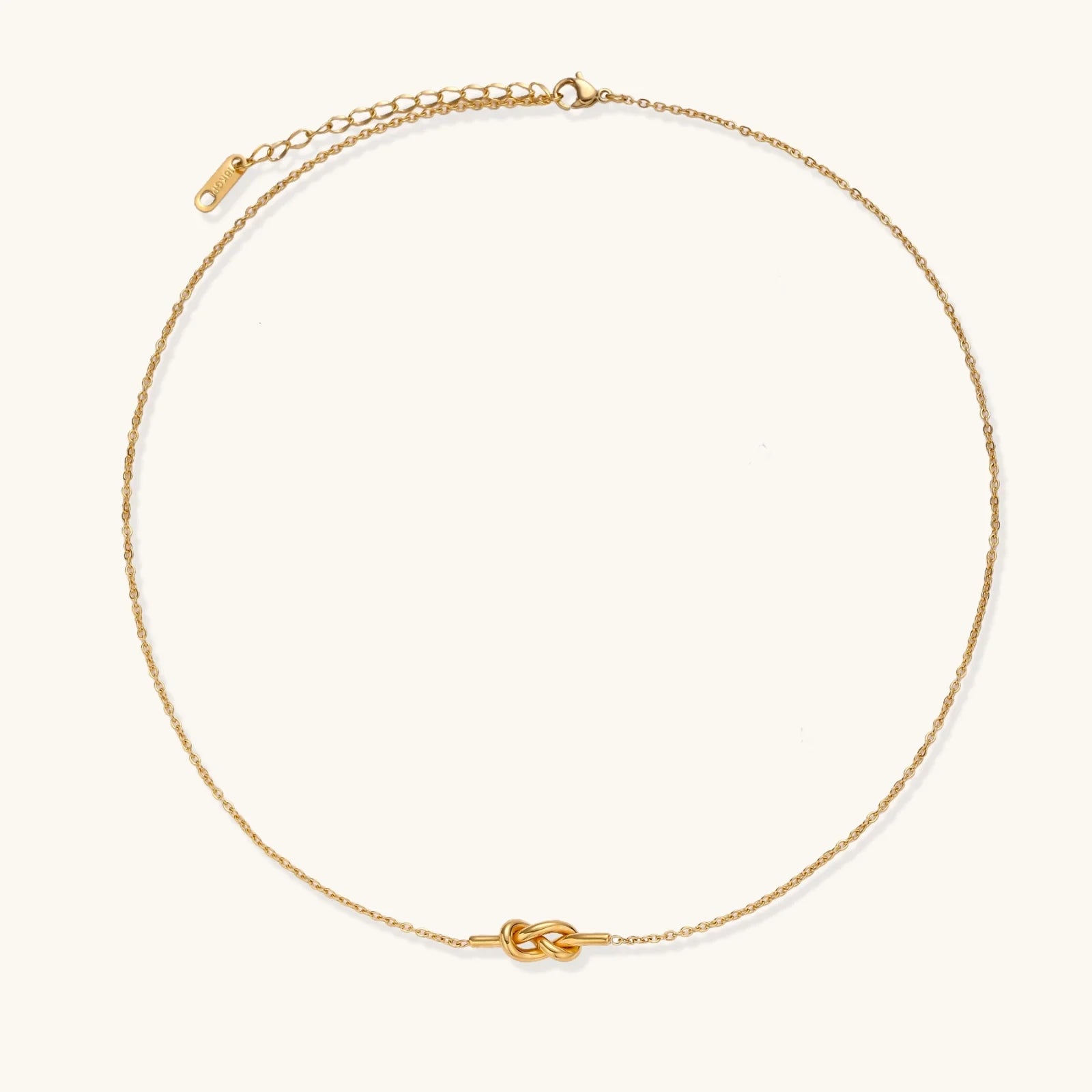 A well-lit photo of the 18K gold-plated Unity Knot Necklace by Astral Signature™, focusing on the clasp and chain details. This image illustrates the quality craftsmanship of Astral Design, making it an ideal Gift for Her from the Limited Edition collection.
