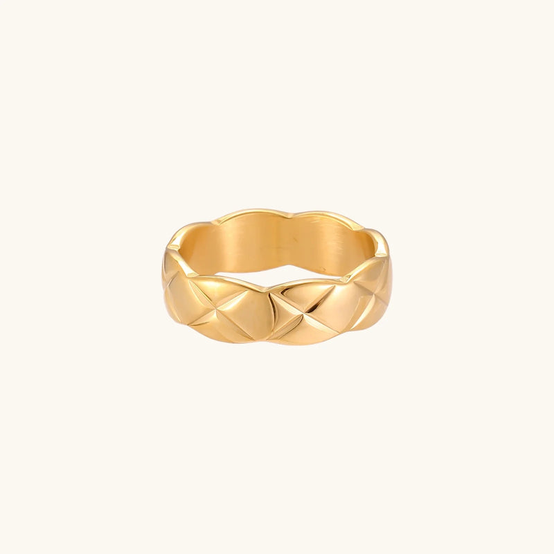 An elegant view of the Twisted Luxe Band by Astral Signature, showcasing its intricate design in 18K gold plating. This chic band is perfect for everyday wear or as a special gift for her, embodying the luxurious craftsmanship that Astral Design is known for. A limited edition piece, it adds a unique flair to any jewelry collection.