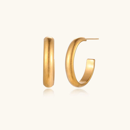 A clear view of the 14K Gold Plated Golden Hour Earring Set by Astral Signature™, displayed on a neutral background to highlight their unique shape and finish. This limited edition item is a stylish gift for her, showcasing the remarkable Astral Design.