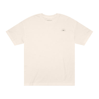 Unisex Classic Logo Tee – Sunrise by Astral Signature in soft beige, designed as a minimal tee that fits all occasions. A perfect choice for those seeking a comfortable basic t-shirt that embodies gender neutrality and style.