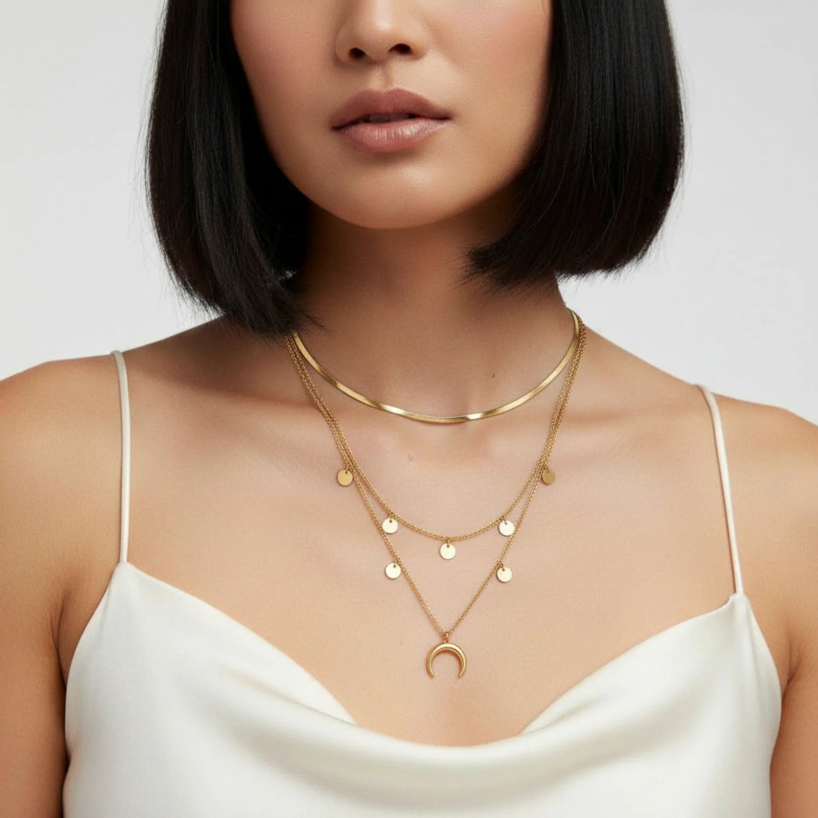 Another angle of the stunning Golden Crescent Layer Set Necklace by Astral Signature, worn by a model showcasing its versatility. This exquisite necklace is the perfect addition to any wardrobe, ideal for everyday wear or as a limited edition gift for her.