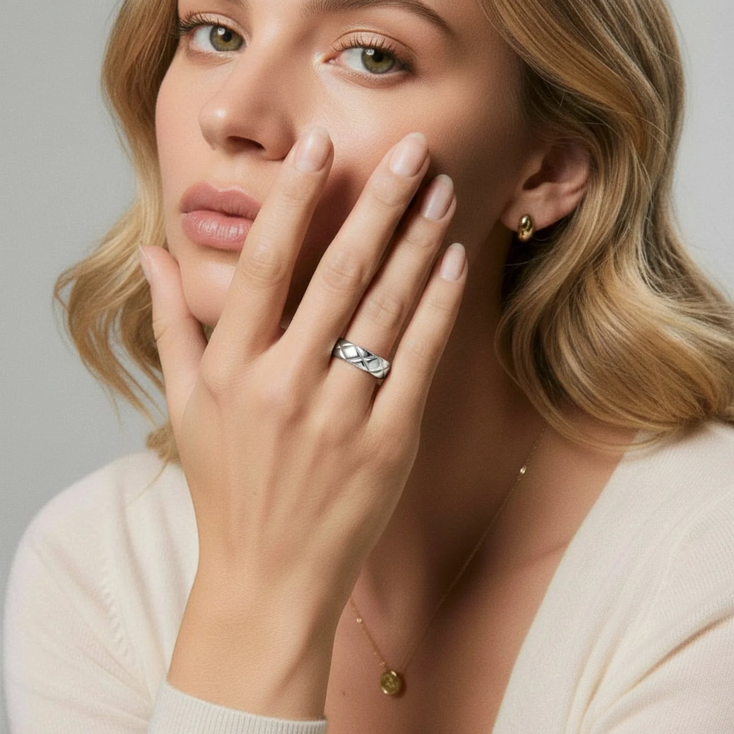 A close-up shot of a model wearing the Quilt Steel Ring by Astral Signature, showcasing the intricately braided design. This stunning piece is part of the limited edition Astral Design collection, a perfect gift for her.