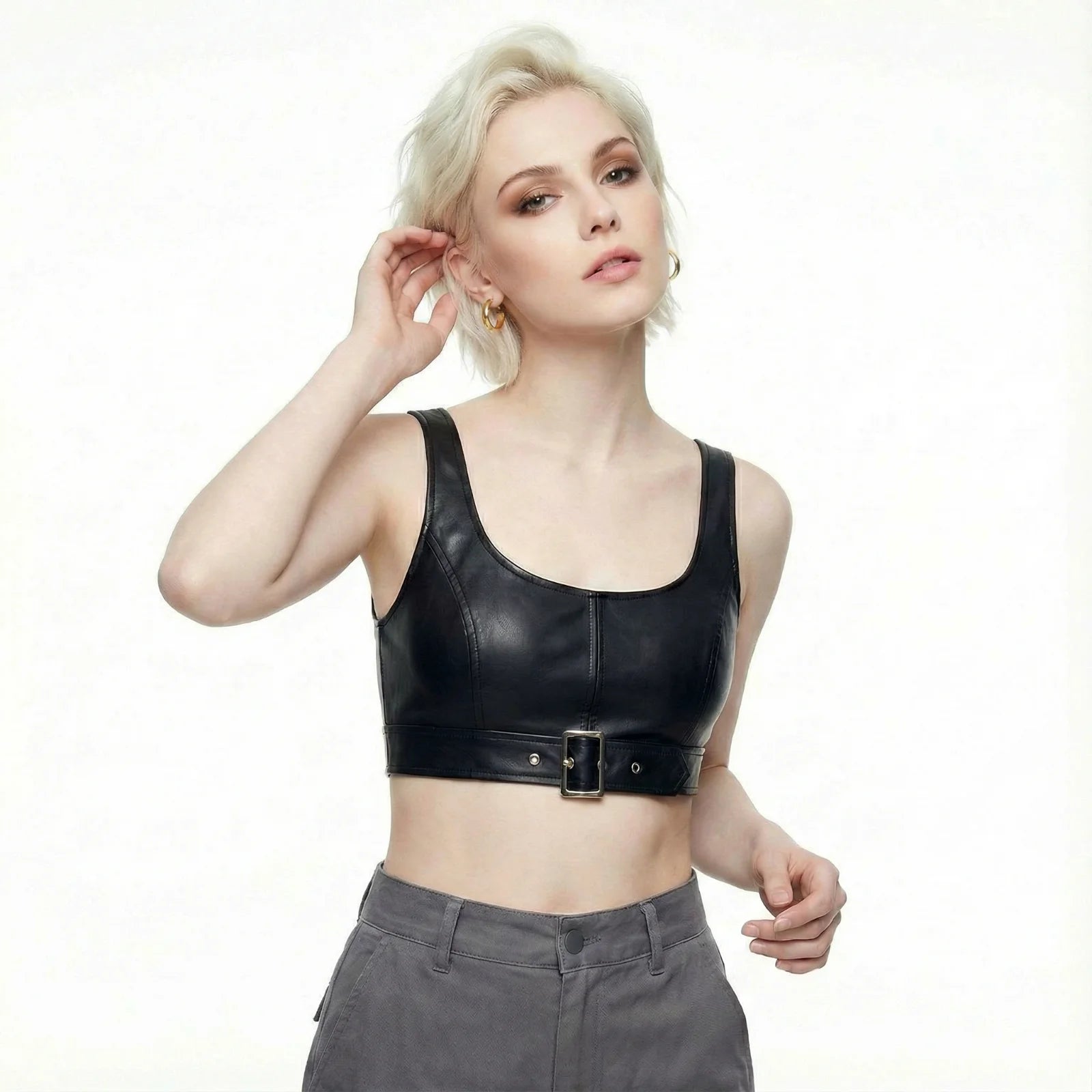 Stylish woman adjusting her hair while wearing the 14K Gold Plated Golden Hour Earring Set by Astral Signature™, highlighting elegance and sophistication. This limited edition jewelry piece is a great gift for her, featuring the signature Astral Design.