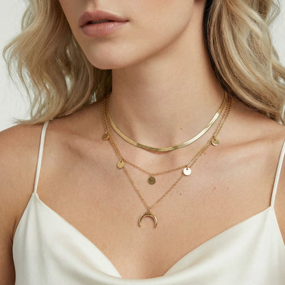 Close-up of the Golden Crescent Layer Set Necklace by Astral Signature, highlighting the layered design with celestial charms. This elegant jewelry is ideal for casual outings and special occasions, serving as a thoughtful gift for her. Limited edition piece that adds sophistication to everyday wear.