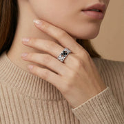 Close-up of the Pixel Dream Ring — White Gold Plated Eco-Brass • Zirconia by Astral Signature worn on a model's finger, showcasing its adjustable nature and the brilliance of zirconia stones, making it a chic eco-brass choice and a lovely Gift for Her.