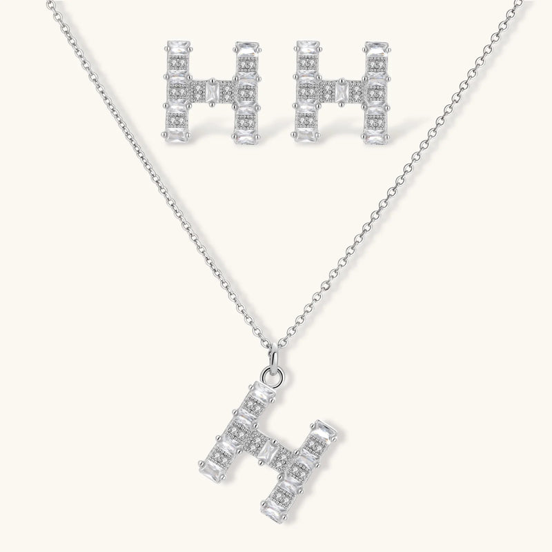 Crystal H Initial Set earrings and pendant necklace designed by Astral Signature, featuring a geometric 'H' silhouette adorned with sparkling zirconia.