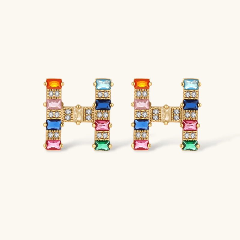 Colorful stud earrings from the Crystal H Initial Set by Astral Signature, featuring an 'H' design with vibrant gemstones and sparkling zirconia.