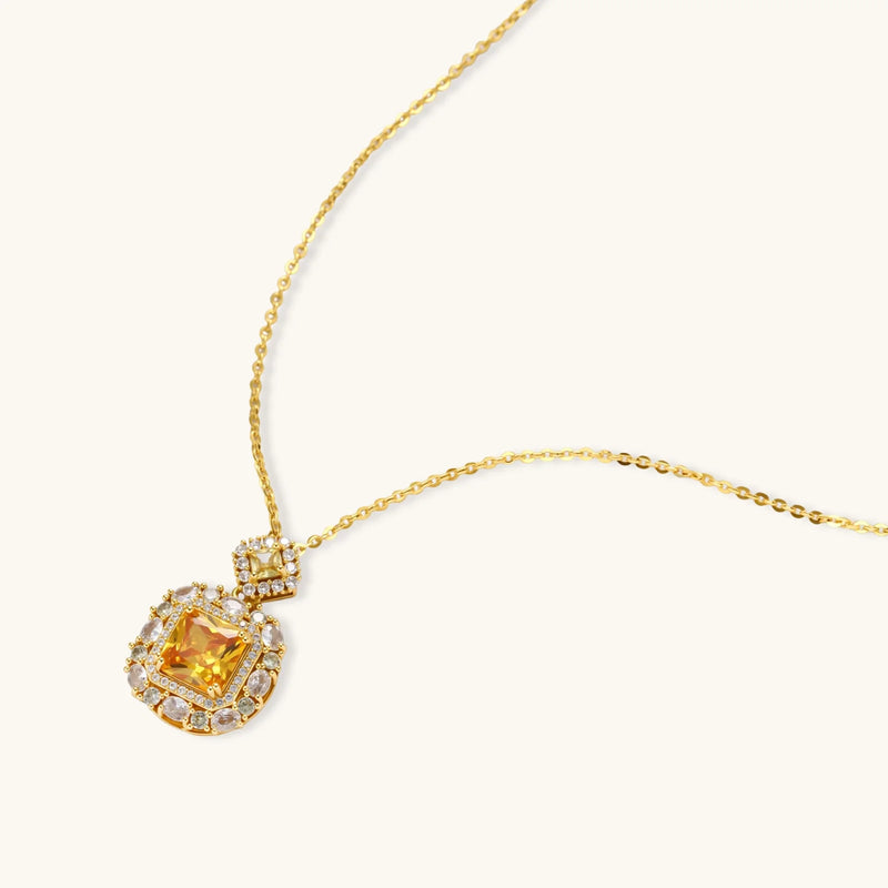 Close-up of the yellow pendant necklace from the heirloom square gold jewelry set with zirconia by Astral Signature.