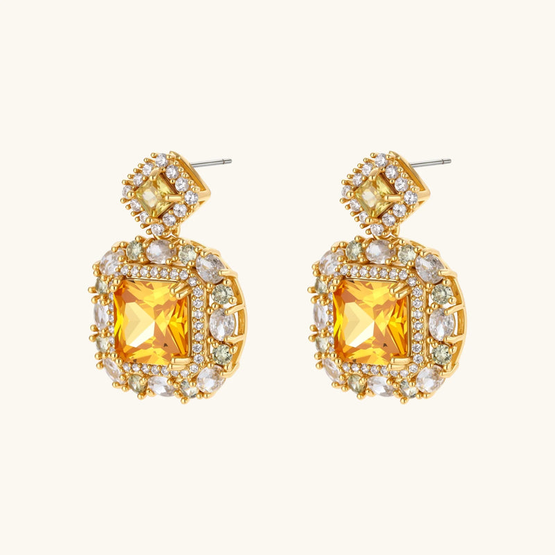 Close-up of yellow earrings from the heirloom square gold jewelry set, enhanced with zirconia, designed by Astral Signature.