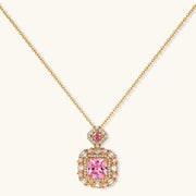 Focus on the pink zirconia pendant necklace from the heirloom square gold jewelry set by Astral Signature, showcasing elegant design.