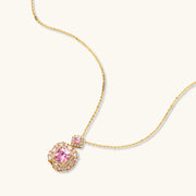 Detailed view of the pink pendant necklace from the heirloom square gold jewelry set featuring zirconia by Astral Signature.