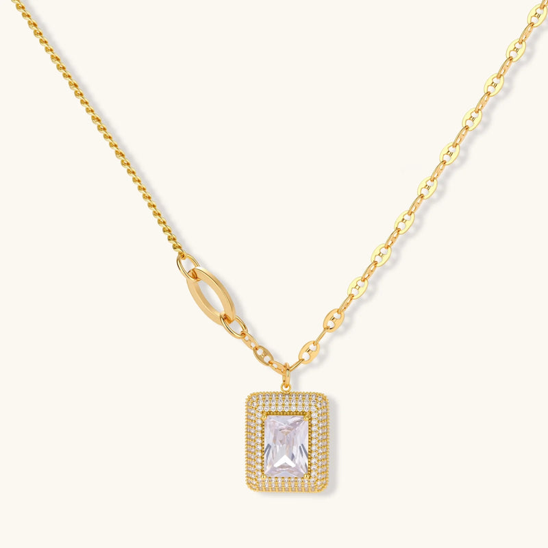 Elegant Emerald Cut Halo Set pendant necklace on a neutral background with a focus on the gold-plated eco-brass and zirconia accents, designed by Astral Signature.