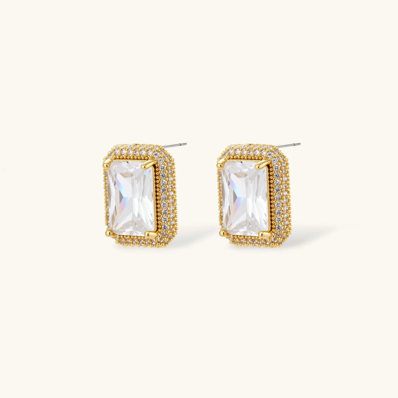Stud earrings from the Emerald Cut Halo Set by Astral Signature, featuring radiant zirconia stones surrounded by gold-plated detailing for a luxurious look.