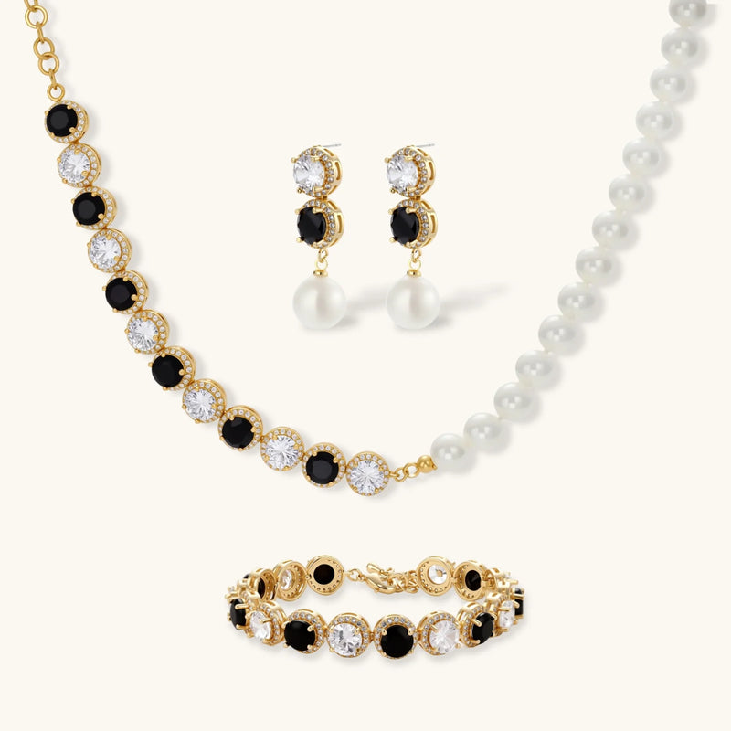 Astral Signature™ Noir Luxe black and gold jewelry set featuring a stunning necklace, statement earrings, and a coordinating bracelet with zirconia.