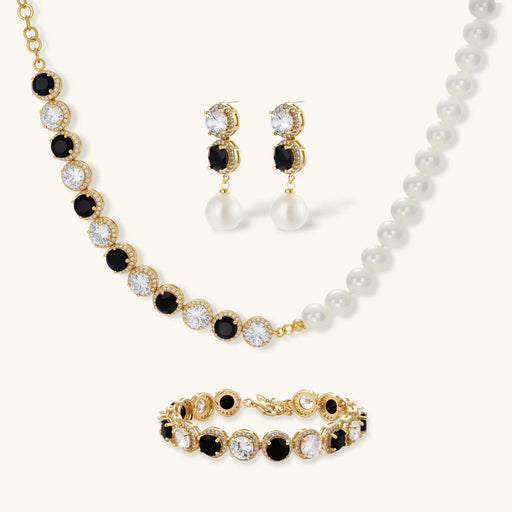 Astral Signature™ Noir Luxe black and gold jewelry set featuring a stunning necklace, statement earrings, and a coordinating bracelet with zirconia.