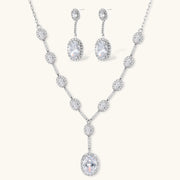 Celestial Cascade Set by Astral Signature featuring a Y-shaped necklace and matching drop earrings adorned with zirconia stones and white gold plating.