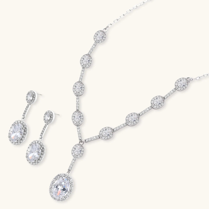 Celestial Cascade Set by Astral Signature displayed with Y-shaped necklace and matching earrings, showcasing the elegance of white gold and zirconia.