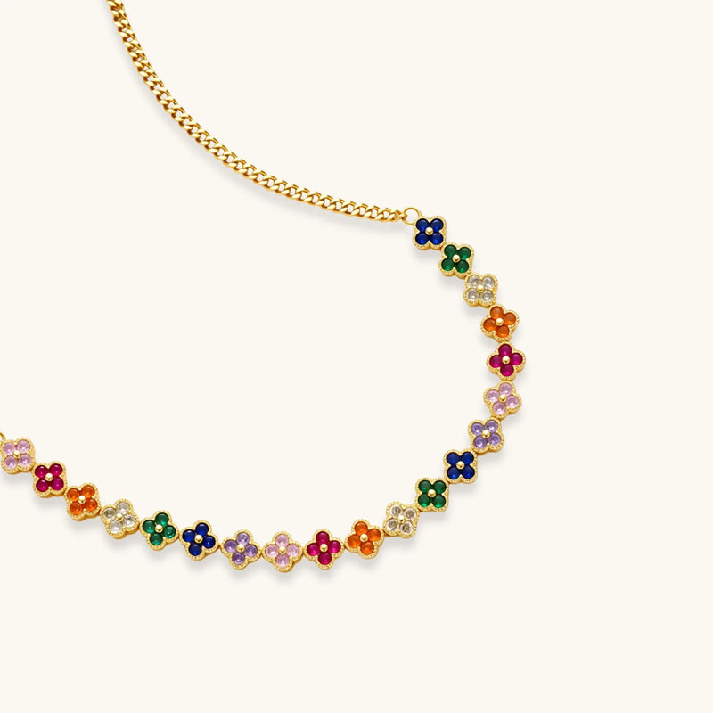 Close-up of the Lucky Clover Garden Set necklace by Astral Signature, featuring an adjustable chain with colorful clover designs and sparkling zirconia.