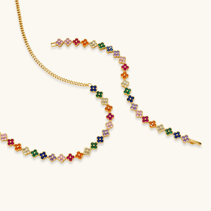 Flat lay of the Lucky Clover Garden Set by Astral Signature, showcasing the necklace and bracelet with a harmonious arrangement of colorful clover motifs.