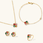 Lucky Clover Jewelry Set Astral Signature™ Edit showcasing a pendant necklace, bracelet, matching stud earrings, and an adjustable ring, designed with multicolor zirconia.
