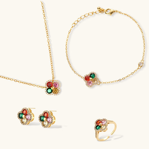 Lucky Clover Jewelry Set Astral Signature™ Edit showcasing a pendant necklace, bracelet, matching stud earrings, and an adjustable ring, designed with multicolor zirconia.