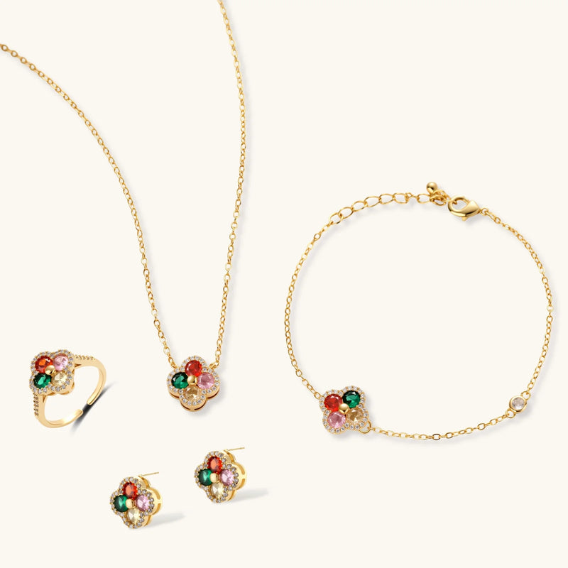 Lucky Clover Jewelry Set Astral Signature™ Edit showing a complete set including a necklace, bracelet, adjustable ring, and stud earrings in a floral theme.