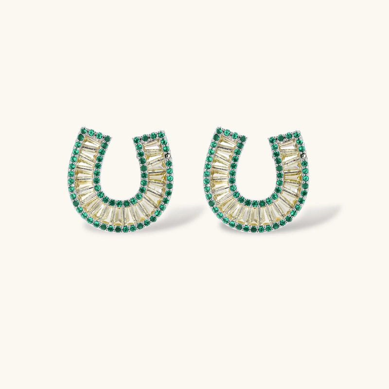 Detailed view of earrings from the gold horseshoe jewelry set by Astral Signature, showcasing intricate zirconia embellishments.