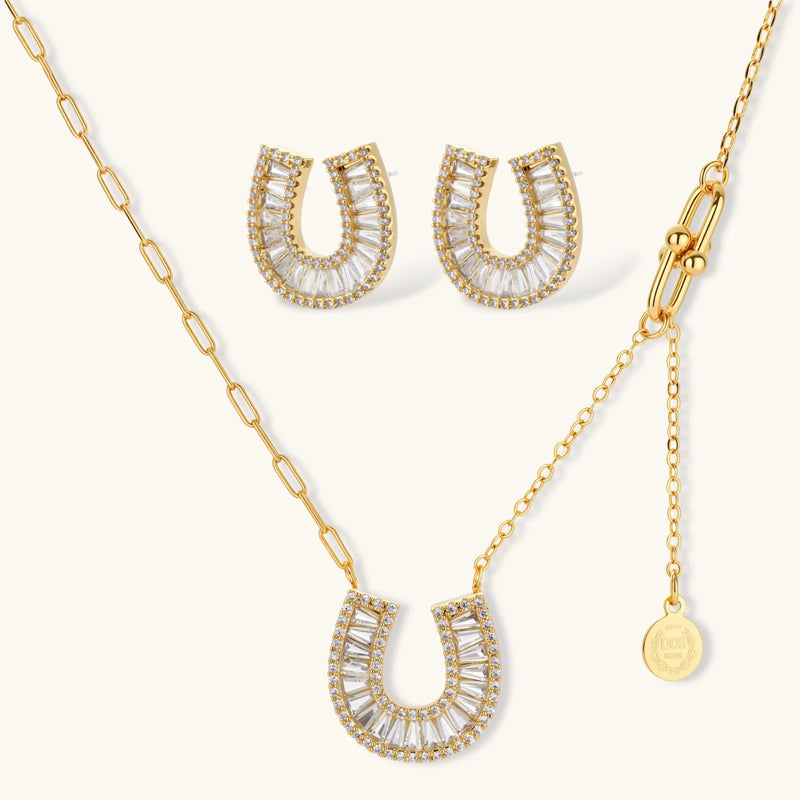 Elegant gold horseshoe jewelry set necklace with sparkling zirconia elements, designed by Astral Signature for luxurious appeal.