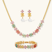 Garden Bloom Jewelry Set showcasing a three-piece collection including a floral pendant necklace, statement earrings, and a bracelet, designed by Astral Signature.