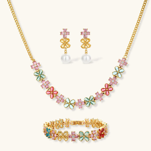 Garden Bloom Jewelry Set showcasing a three-piece collection including a floral pendant necklace, statement earrings, and a bracelet, designed by Astral Signature.